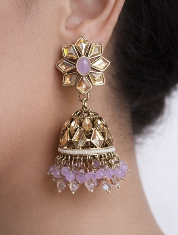 dome shape earring in golden and purple color