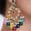 a colorful and golden earring on a model